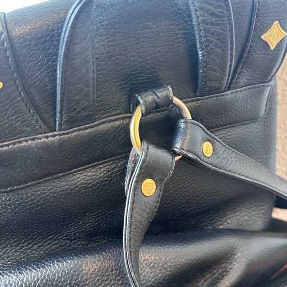 MCM Black Leather Drawstring Shoulder Backpack with Gold Accents - Picture 9 of 11